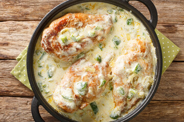 Pollo a la Crema features chicken breasts in a crema sauce with sauteed green peppers, onion and...