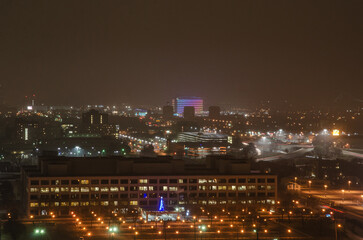 View of Downtown Detroit from the Fisher Building at night on a cloudy day.