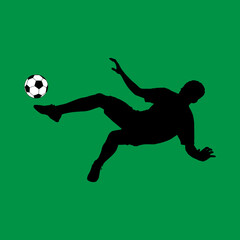 Fototapeta na wymiar silhouette of a football player hitting the ball in the fall