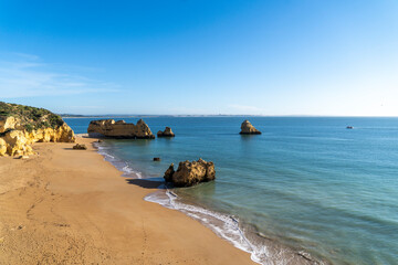 Praia Dona Ana beach with turquoise sea water ocean and cliffs. Beautiful Dona Ana Beach (Praia Dona Ana) in Lagos, Algarve, Portugal.