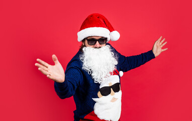 Fototapeta na wymiar santa claus bearded man in glasses wish happy new year and merry christmas holiday ready to celebrate winter party with fun and joy full of xmas presents and gifts, greeting