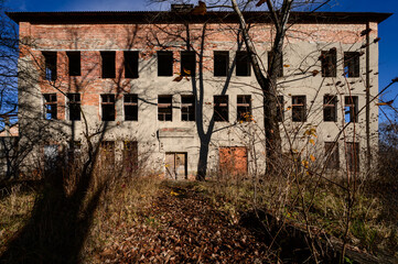 destroyed industrial building from the outside, a three-story industrial building
