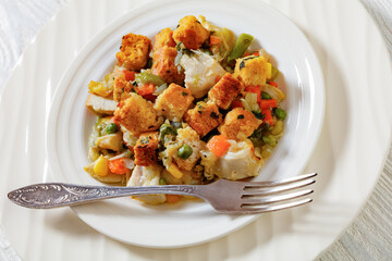 turkey pot pie with stuffing crust on plate