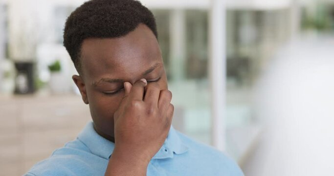 Black man, professional burnout and stress with headache, anxiety and frustrated with work, overworked and fail with mistake while working. Businessman, glasses and tired, angry with job problem.