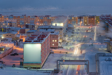 Winter cityscape. Top view of the snow-covered northern city. Severe cold climate in the Arctic. Anadyr, Chukotka, Far North of Russia.