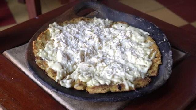 Arepa is a type of food made of ground maize dough stuffed with a filling, eaten in the northern region of South America since pre-Columbian times -  cuisine of Colombia and Venezuela - cheese arepas