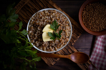 Boiled buckwheat porridge on old background
