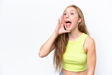 Young caucasian woman isolated on white background shouting with mouth wide open to the side
