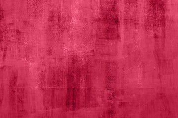 Trendy 2023 Viva Magenta color grungy red background with old cement texture as a wall in retro...