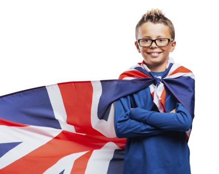 Smiling superhero boy with British flag cape