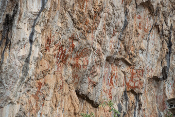 An image of an ancient men, a hunting scene on the wall of a cave. archeology. stone Age.