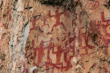 Horizontal image of the Ancient rock paintings in Zuojiang Huashan, Guangxi, China