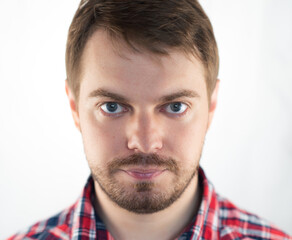 Obraz premium Portrait of a sad man with blue eyes. Selective focus.