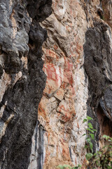 Rock painting in Zuojiang Huashan Rock art, Guangxi, China. The picture seems to depict a ritual or a hunt