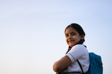 Portrait of rural Indian school girl with backpack