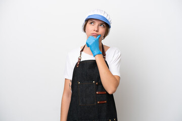 Fishmonger woman wearing an apron having doubts