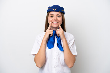 Airplane Lithuanian woman stewardess isolated on white background smiling with a happy and pleasant expression