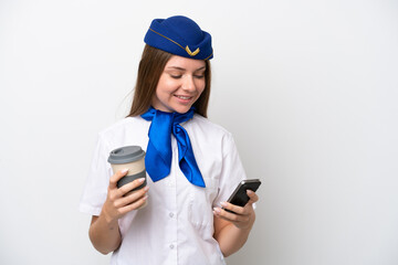 Airplane Lithuanian woman stewardess isolated on white background holding coffee to take away and a mobile