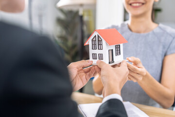 Real estate agents send clients models of houses and house keys, Making insurance or signing a real estate loan purchase agreement.