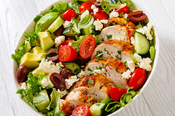 Mediterranean grilled Chicken Salad in white bowl