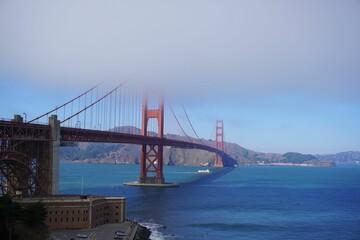 Low-angle of Golden Gate Bridge on a sunny day clear sky background