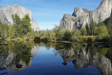 High-angle of Lorentz national park view with water cliffs trees sunlit clear sky background