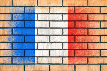 Flag of France. Flag painted on a brick wall. Brick background. Copy space. Textured background