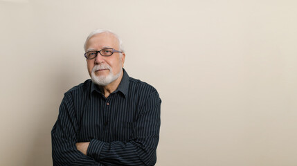 An elderly man in glasses sits on a light background, looking at the camera, banner, place for text