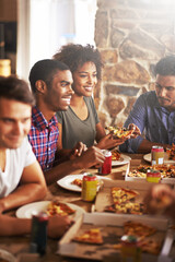 Friends eat pizza, lunch and food at restaurant with fun together on friendship date, party or...