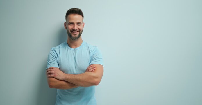 Portrait Of Happy Casual Man Smiling, Young Guy Standing At White Wall, Isolated On White Background, Copy Space.