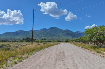 Fototapeta na wymiar gravel road in the countryside near La Sal mountains (San Juan county, Utah)