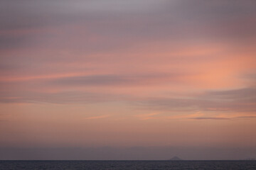 Naklejka na ściany i meble Sunset at the ocean beach