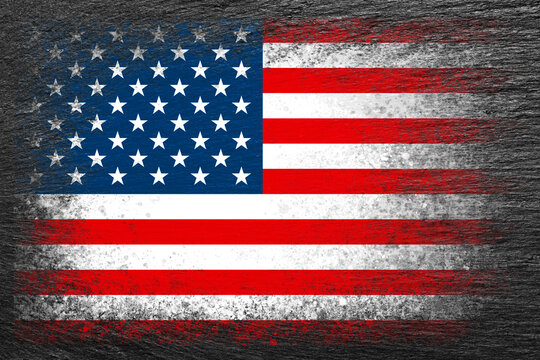 Flag of USA. Flag is painted on black slate stone. Stone background. Copy space. Textured background