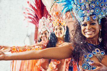 Brazil, dance and carnival with a woman group at a festival during a performance of tradition, culture or heritage. Portrait, event and celebration with female dancers dancing in rio de janeiro