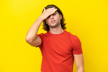 Caucasian handsome man isolated on yellow background with tired and sick expression