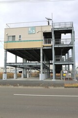 Sendai, Miyagi, Japan, December 2022.Nakano 5-chome Tsunami Evacuation Tower and surrounding scenery.