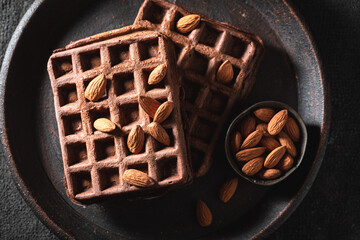 Tasty and fresh waffles with nuts and chocolate.