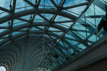 Tbilisi, GEORGIA : 05 - 10 - 2022 : The Bridge of Peace is a bow-shaped pedestrian bridge over the Kura River in old Tbilisi, Georgia