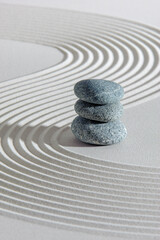 Japanese zen garden with stone in textured sand
