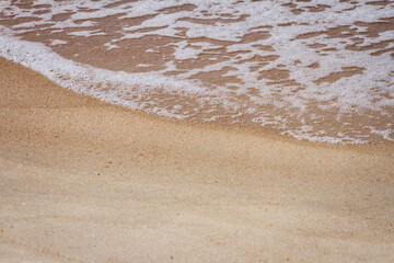 Sand beach and waves