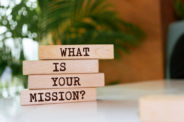 Wooden blocks with words 'What is your mission Question'. Business concept