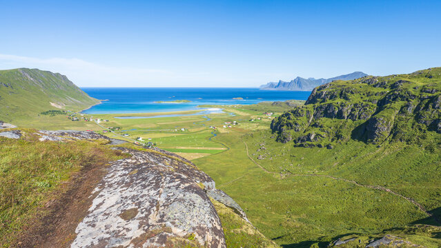 hiking mount ryten and kvalvika beach on lofoten islands in norway