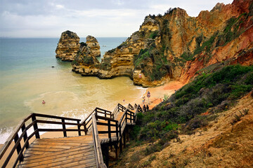 wooden steps leading to Camilo beach - Praia do Camilo, near Ponta da Piedade, Lagos, Algarve, Faro district, Portugal, Europe
