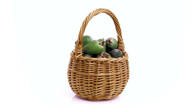 feijoa guava in basket isolated on white background