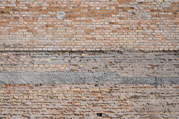 old unplastered brick wall. ruined building.