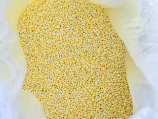 Light yellow small round granules are chemical fertilizers, calcium nitrate