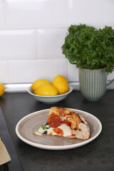 Neapolitan pizza with sausage and jalapeno in the kitchen at home