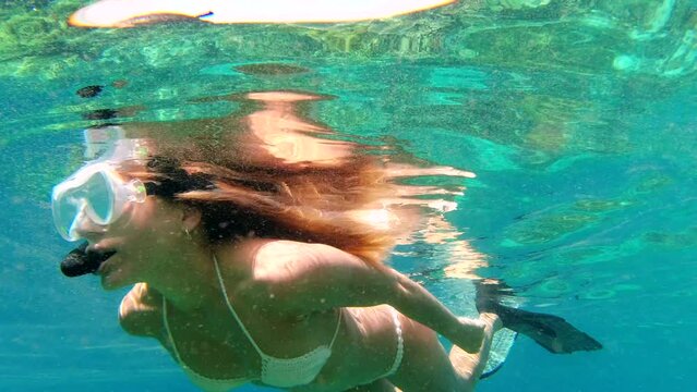 Swimming, ocean and underwater woman snorkeling for fitness exercise, sea adventure or nature pool freedom. Water travel, bikini and sports free diver with swim goggles scuba diving in Bali Indonesia