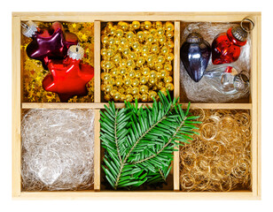 Christmas ornaments in a wooden box. Star and acorn shaped Christmas  bulbs made of colored blown...