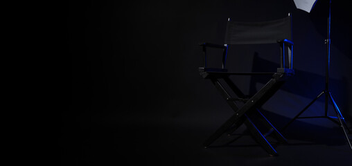 Director chair with cinema lightbox sign Director text on it and clapperboard megaphone and black...